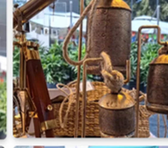 Rustic cow bell wholesale supplier from India — rustic cowbells displayed on a wooden stand