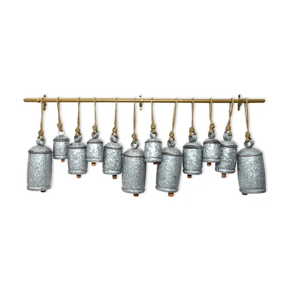 Silver galvanized iron bells on a metal rod
