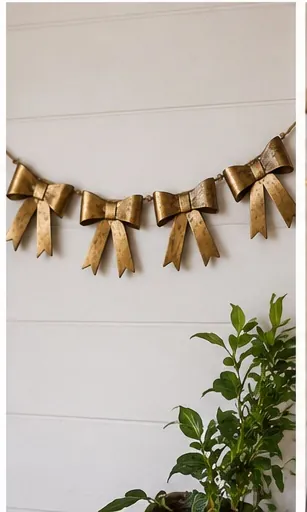 Handmade garland of brass-finish metal bows