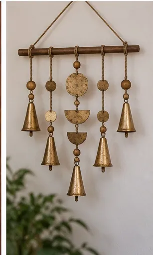 Handmade boho wall hanging with bells, beads and metal discs